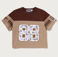 A BATHING APE Ladies' MULTI LOGO FOOTBALL BOXY CROPPED TEE