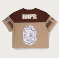 A BATHING APE Ladies' MULTI LOGO FOOTBALL BOXY CROPPED TEE
