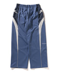 A BATHING APE WILD LEOPARD PATTERN OVERSIZED FIT TRACK PANTS