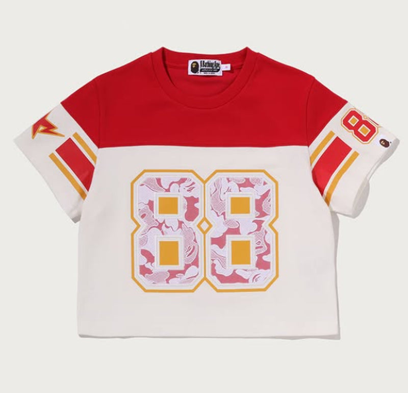 A BATHING APE Ladies' MULTI LOGO FOOTBALL BOXY CROPPED TEE