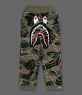 A BATHING APE BAPE KIDS LAYERED LINE CAMO SHARK SWEATPANTS GLOW IN THE DARK