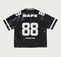 A BATHING APE PU LEATHER CROPPED FIT FOOTBALL JERSEY