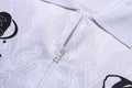 A BATHING APE FLAME PATTERN OVERALL PRINT HALF ZIP RELAXED FIT POLO SHIRT