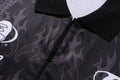 A BATHING APE FLAME PATTERN OVERALL PRINT HALF ZIP RELAXED FIT POLO SHIRT