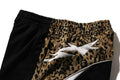 A BATHING APE WILD LEOPARD PATTERN OVERSIZED FIT TRACK PANTS