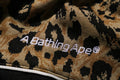 A BATHING APE WILD LEOPARD PATTERN OVERSIZED FIT TRACK PANTS