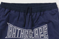 A BATHING APE LAYERED TRACK PANTS