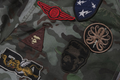 A BATHING APE HYBRID CAMO MULTI BADGE PADDED MA-1 JACKET
