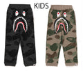 A BATHING APE BAPE KIDS LAYERED LINE CAMO SHARK SWEATPANTS GLOW IN THE DARK