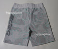 A BATHING APE TEXT CODE CAMO SWEAT SHORTS