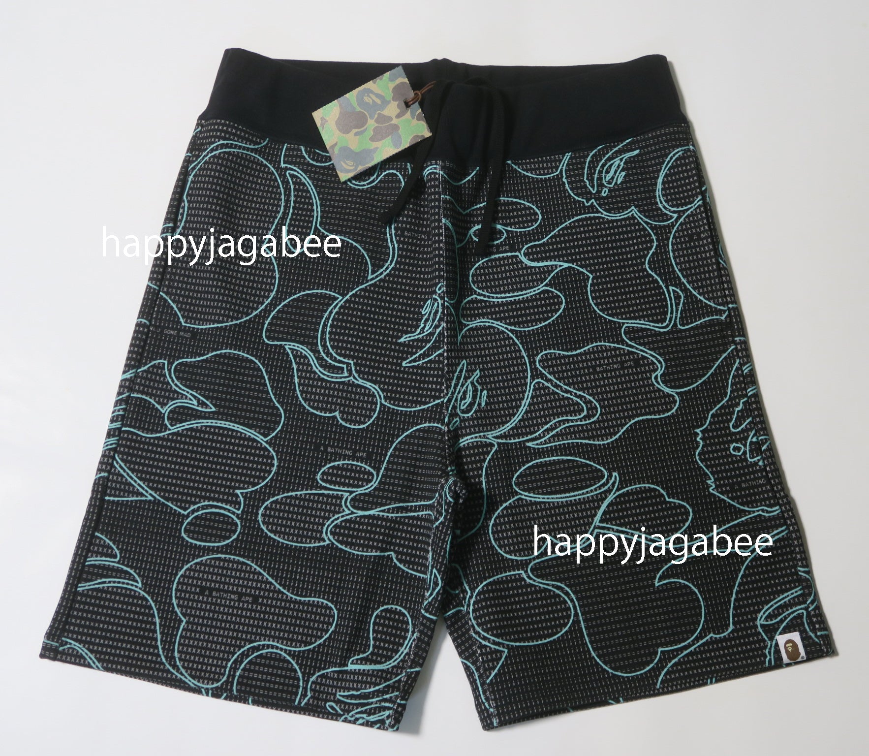 A BATHING APE TEXT CODE CAMO SWEAT SHORTS